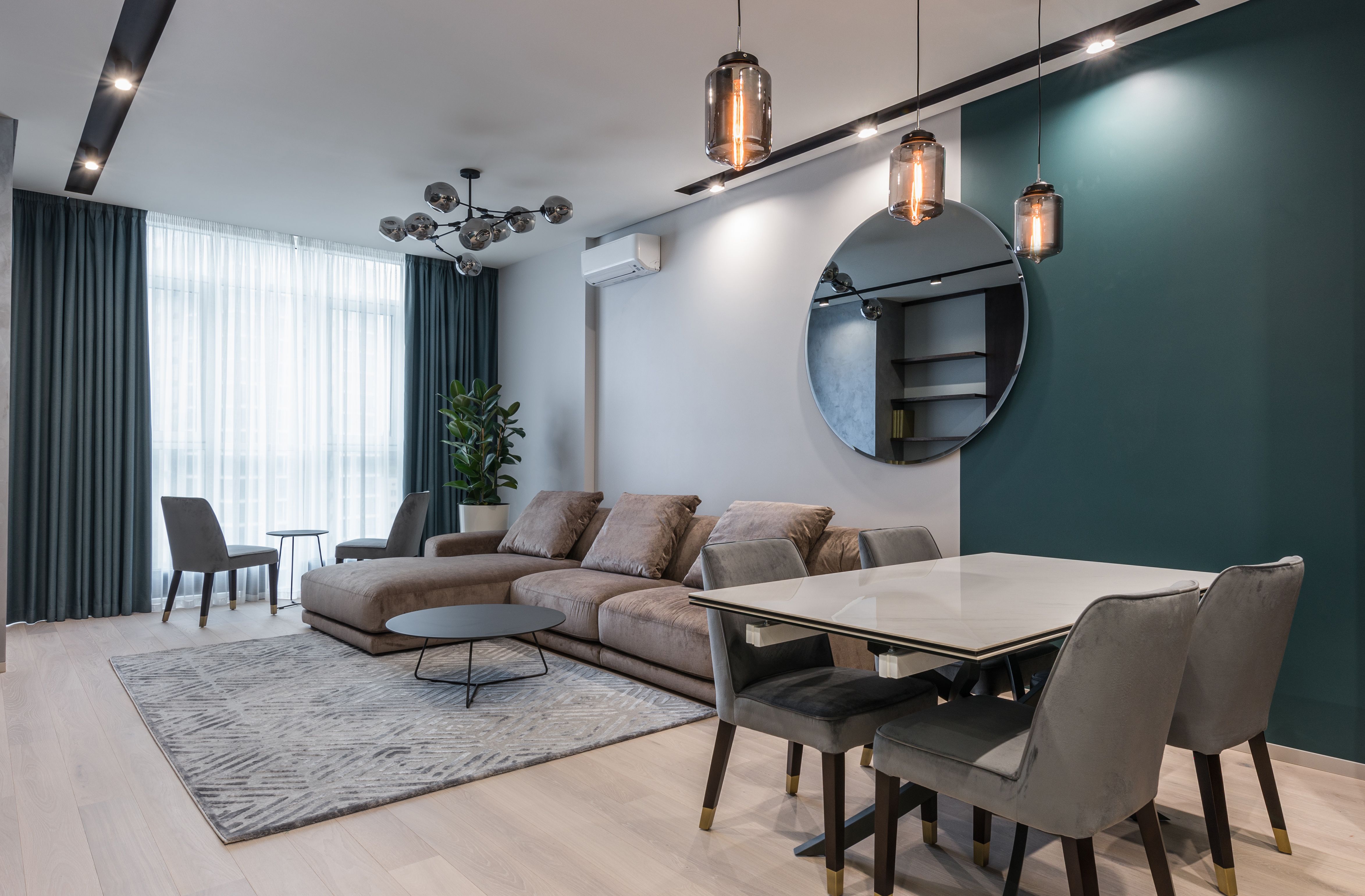 Elegant modern apartment living room with a spacious seating area and warm natural light.