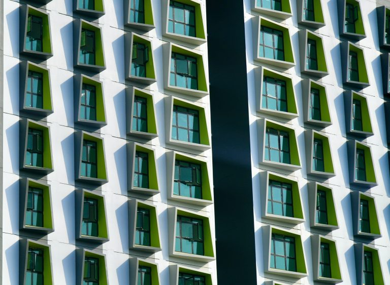 Modern Singapore building facade with distinctive angled windows, representing the contemporary architecture of The Serra Residences.