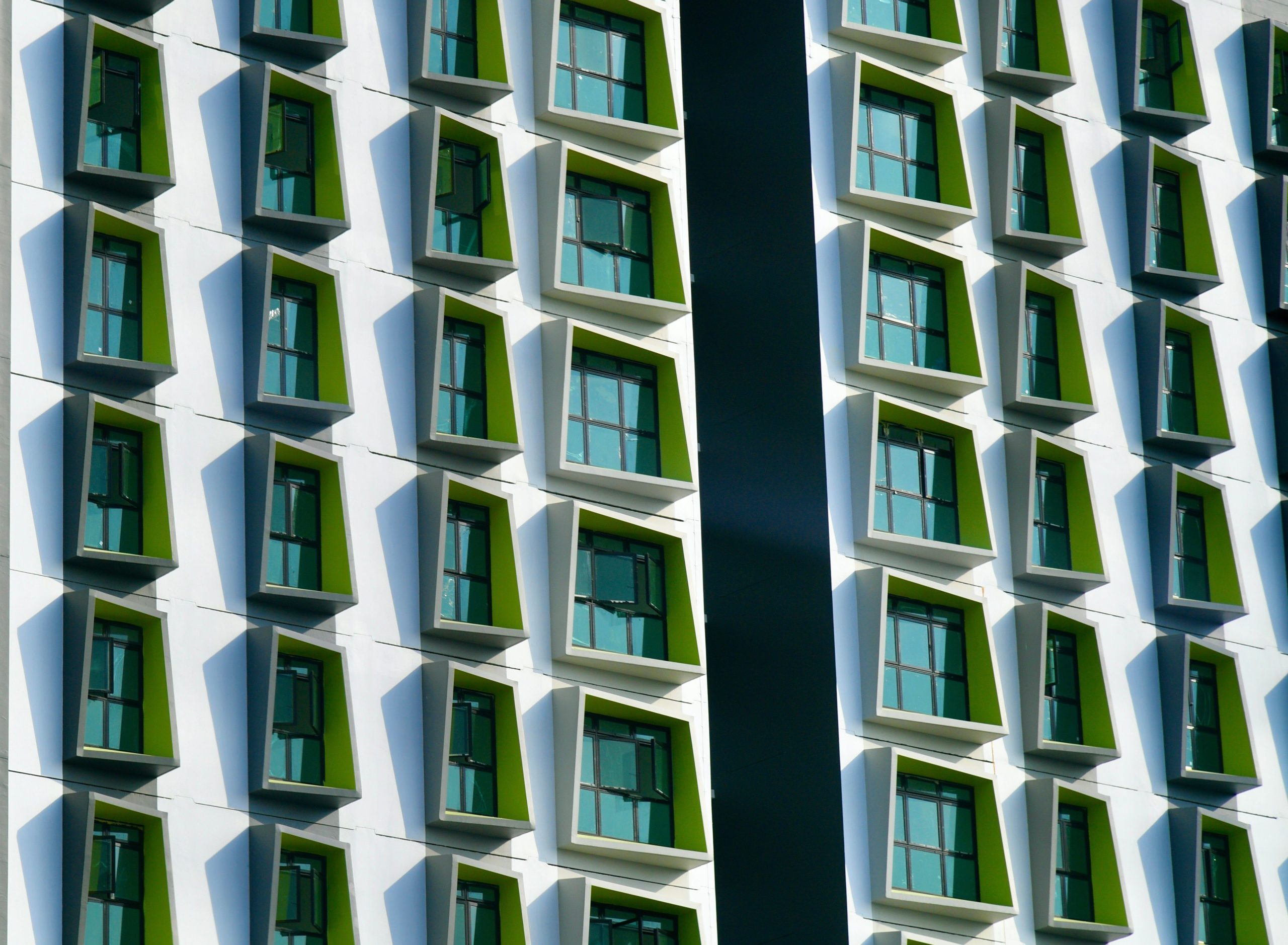 Modern Singapore building facade with distinctive angled windows, representing the contemporary architecture of The Serra Residences.